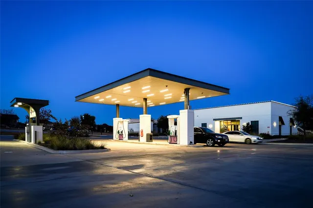 a view of a city street with palm trees