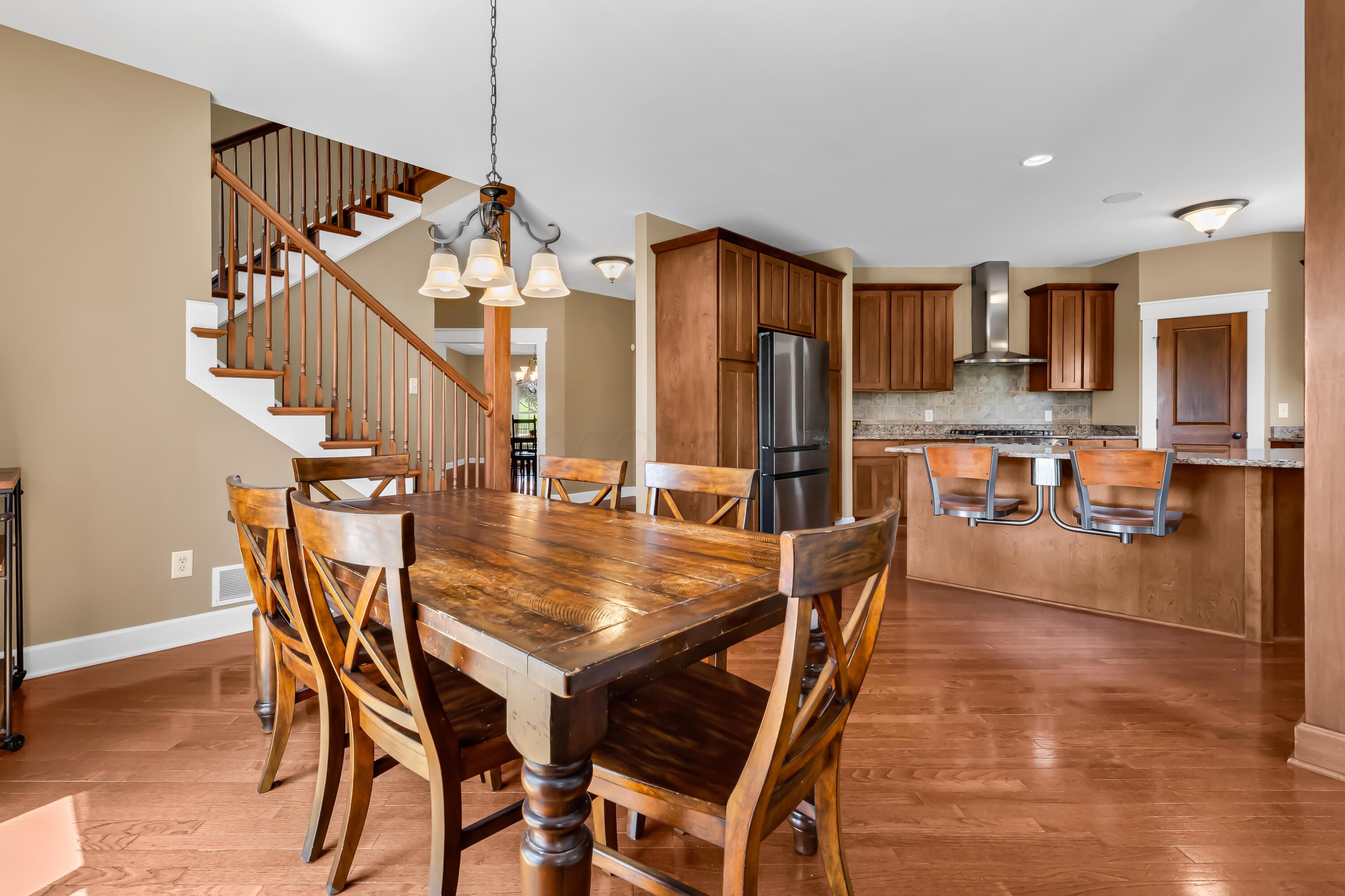 16689 Bailor Road Laurelville, OH 43135 - Photo 25 of 73 • Hardwood flooring
• Tan painted walls
• Chandelier
• Double sliding
doors to patio