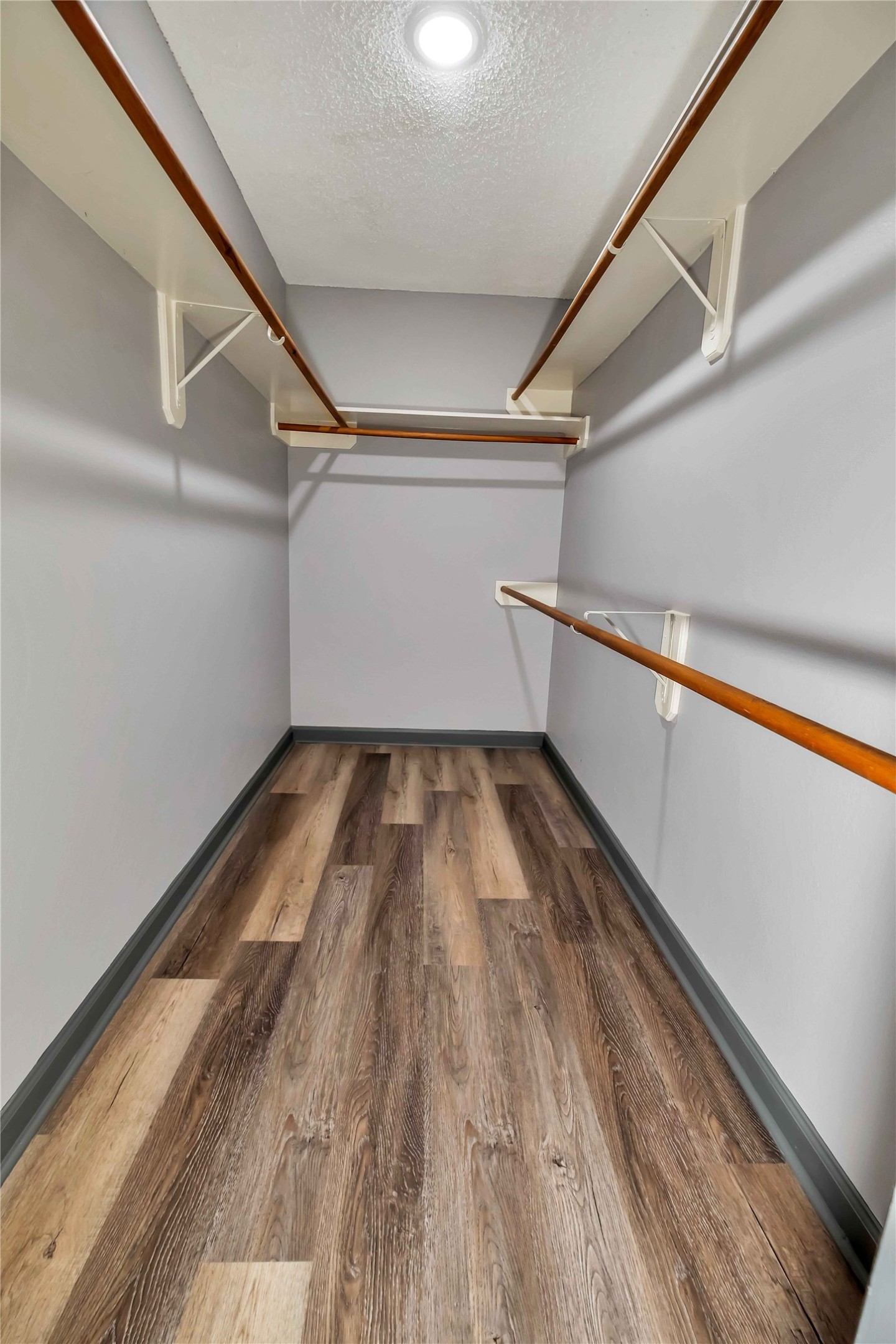 5216 Spring Branch Drive Pearland, TX 77584 - Photo 12 of 17 a view of a room with wooden floor