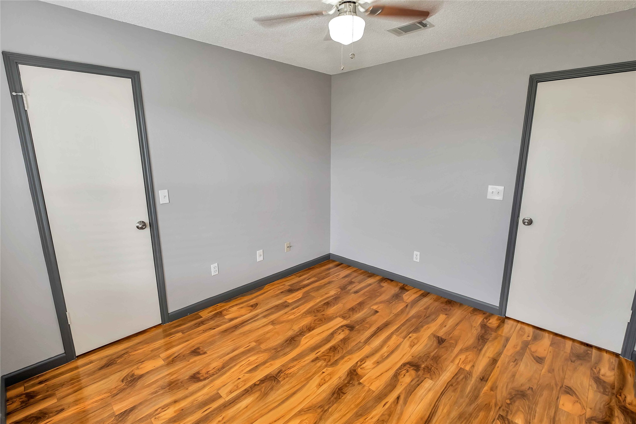 5216 Spring Branch Drive Pearland, TX 77584 - Photo 15 of 17 an empty room with wooden floor