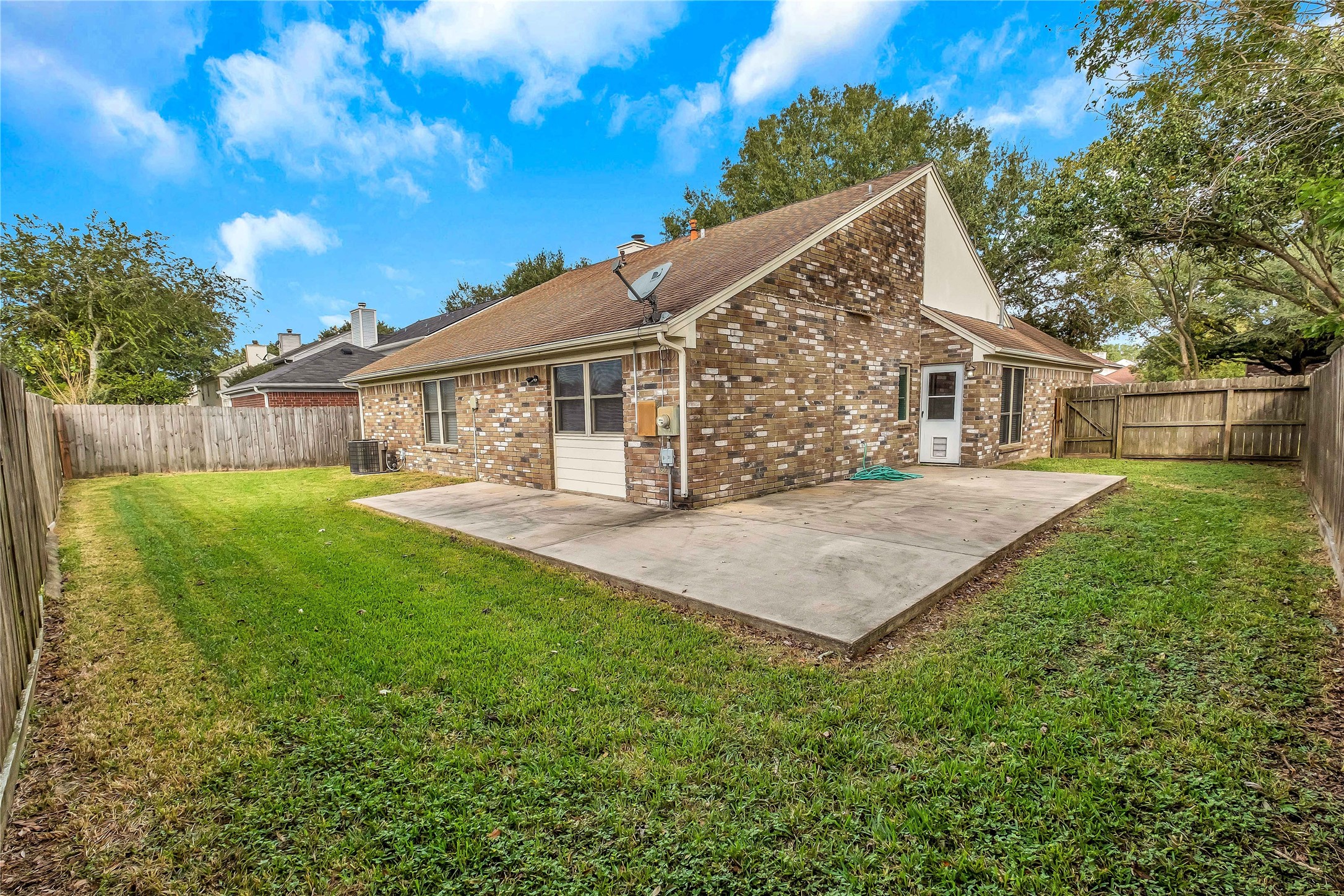 5216 Spring Branch Drive Pearland, TX 77584 - Photo 16 of 17 a front view of house with yard and green space