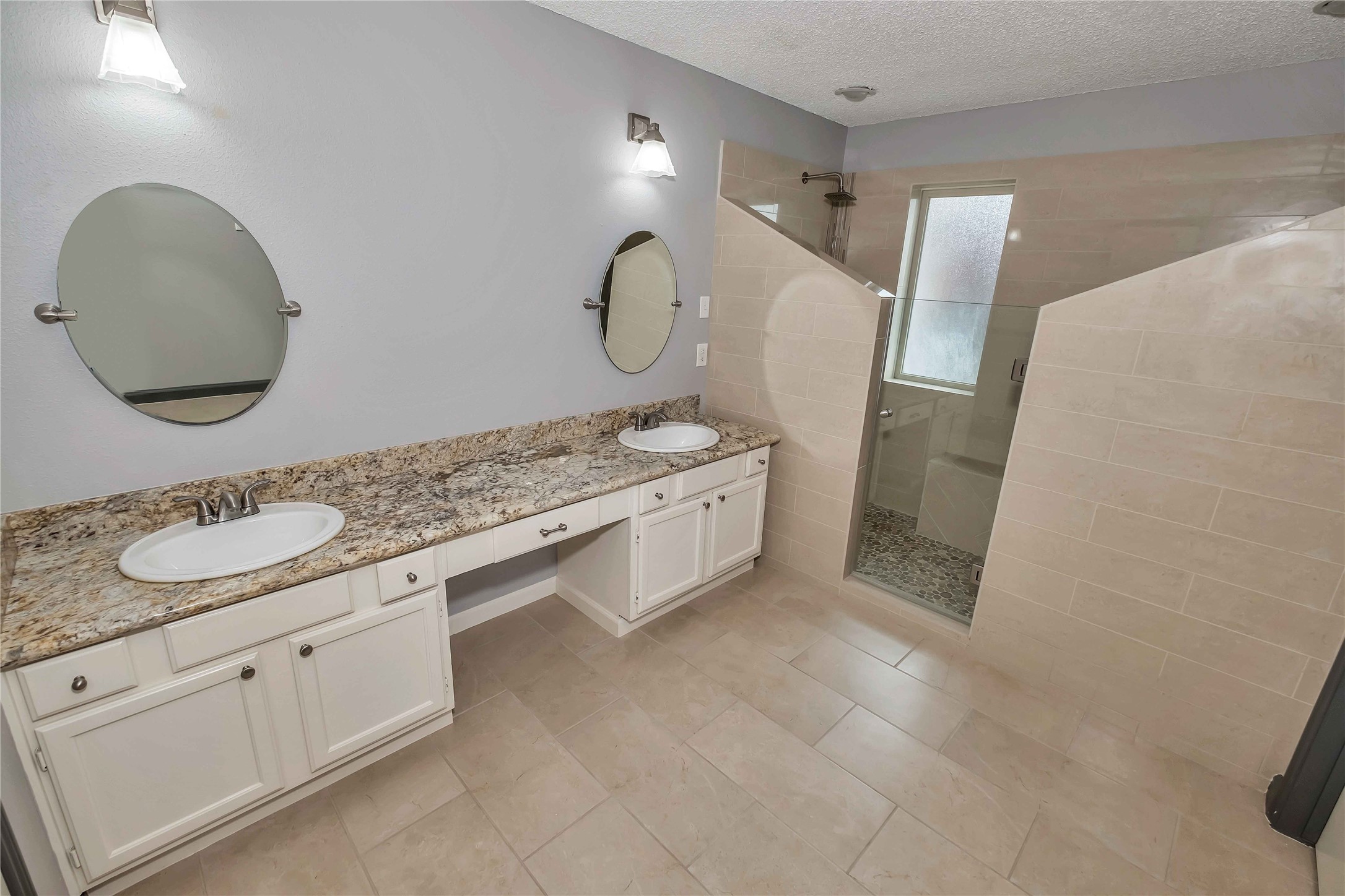 5216 Spring Branch Drive Pearland, TX 77584 - Photo 8 of 17 a bathroom with a sink and a mirror