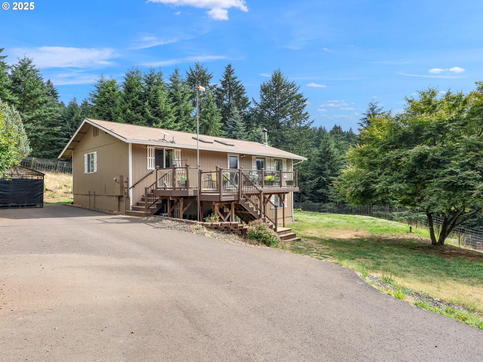 19791 Northeast Sunnycrest Road Newberg, OR 97132 - Photo 2 of 40 a view of a house with backyard and sitting area