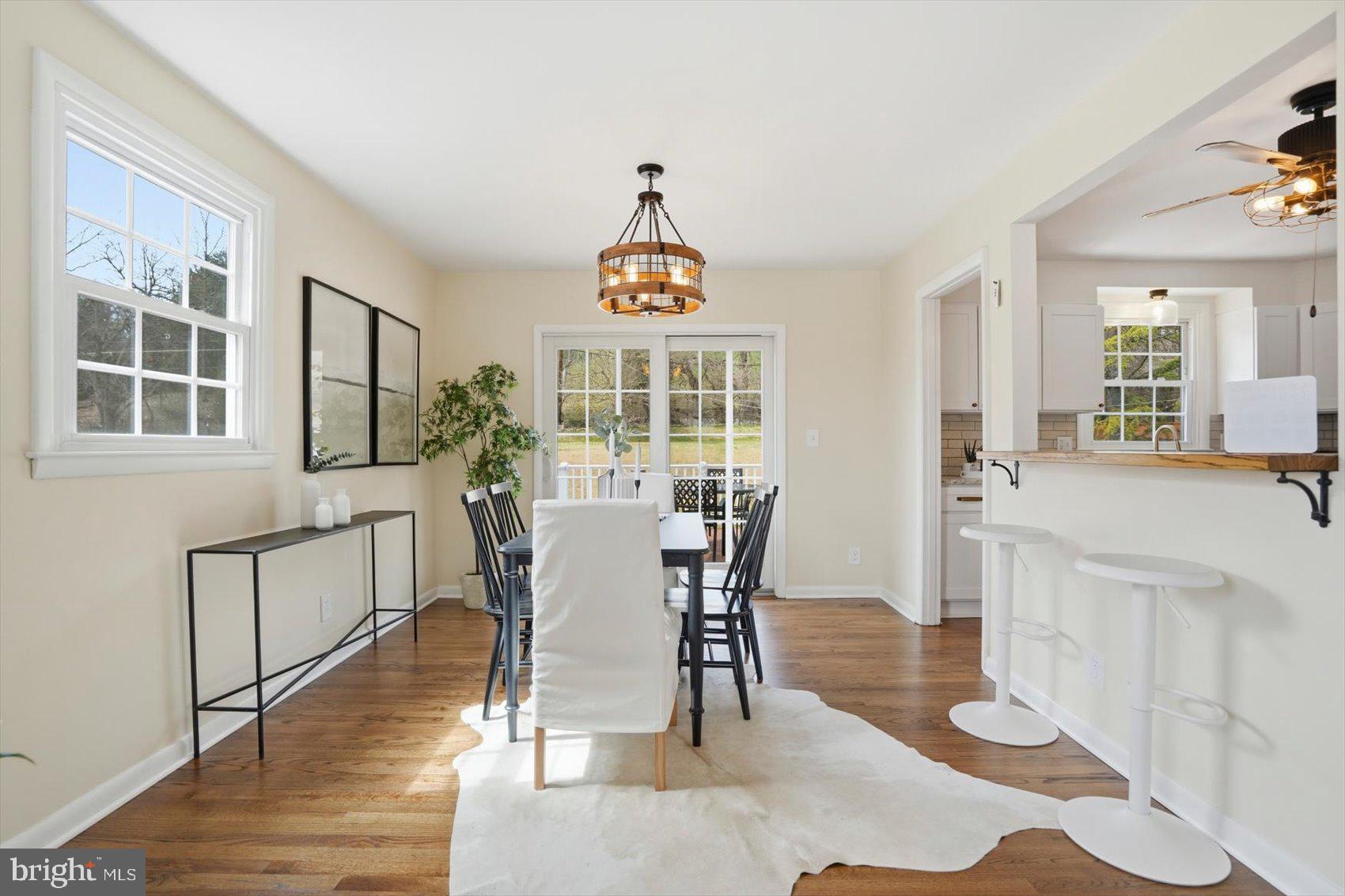 8610 Valleyfield Road Lutherville-Timonium, MD 21093 - Photo 13 of 29 a view of a dining room with furniture window and wooden floor