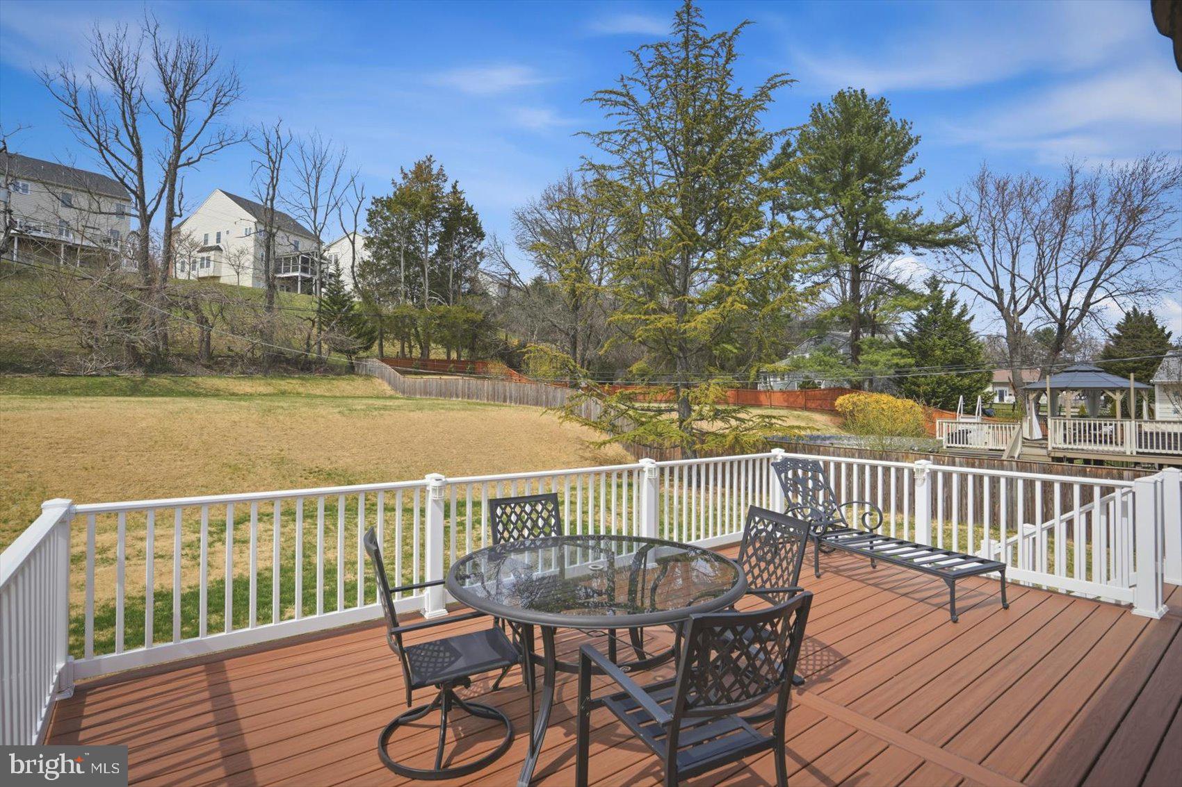 8610 Valleyfield Road Lutherville-Timonium, MD 21093 - Photo 18 of 29 a view of a deck with two chair and wooden floor