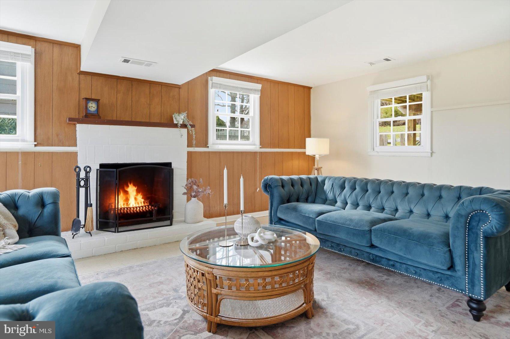 8610 Valleyfield Road Lutherville-Timonium, MD 21093 - Photo 19 of 29 a living room with furniture and a fireplace