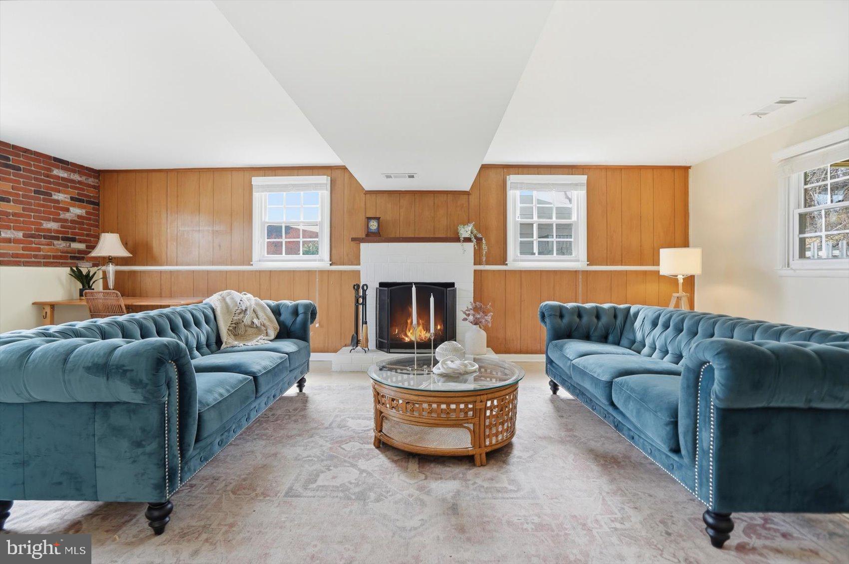 8610 Valleyfield Road Lutherville-Timonium, MD 21093 - Photo 20 of 29 a living room with furniture and a fireplace