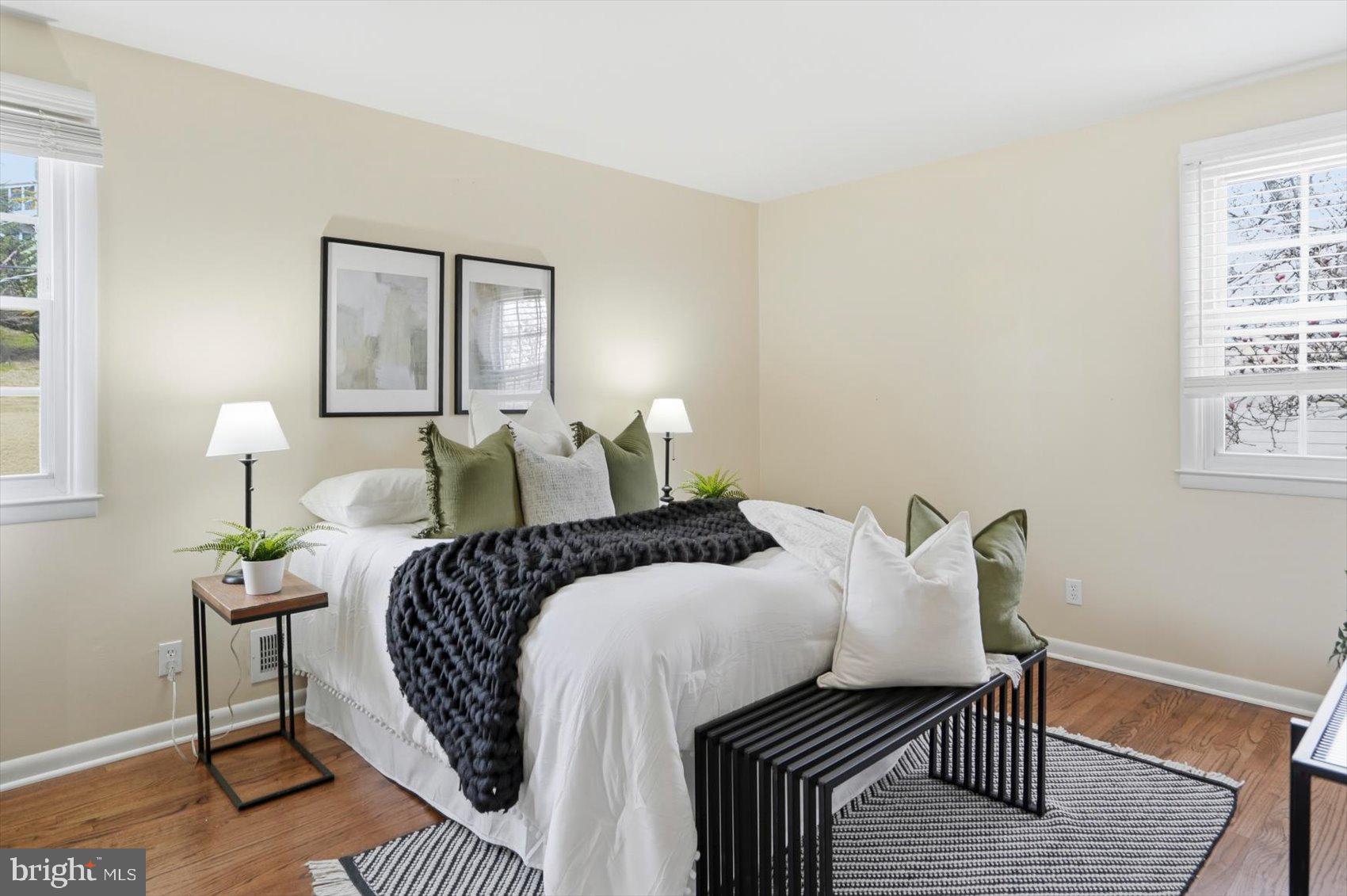 8610 Valleyfield Road Lutherville-Timonium, MD 21093 - Photo 5 of 29 a bedroom with a bed and wooden floor