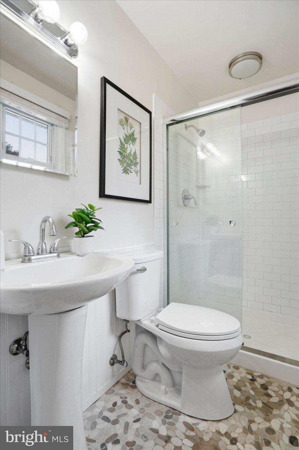 8610 Valleyfield Road Lutherville-Timonium, MD 21093 - Photo 6 of 29 a bathroom with a sink toilet and shower