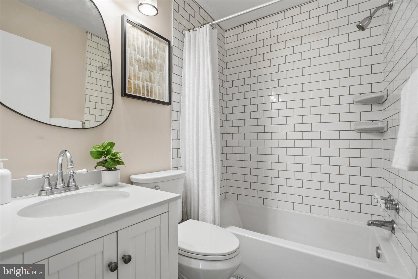 8610 Valleyfield Road Lutherville-Timonium, MD 21093 - Photo 9 of 29 a bathroom with a sink a toilet and shower