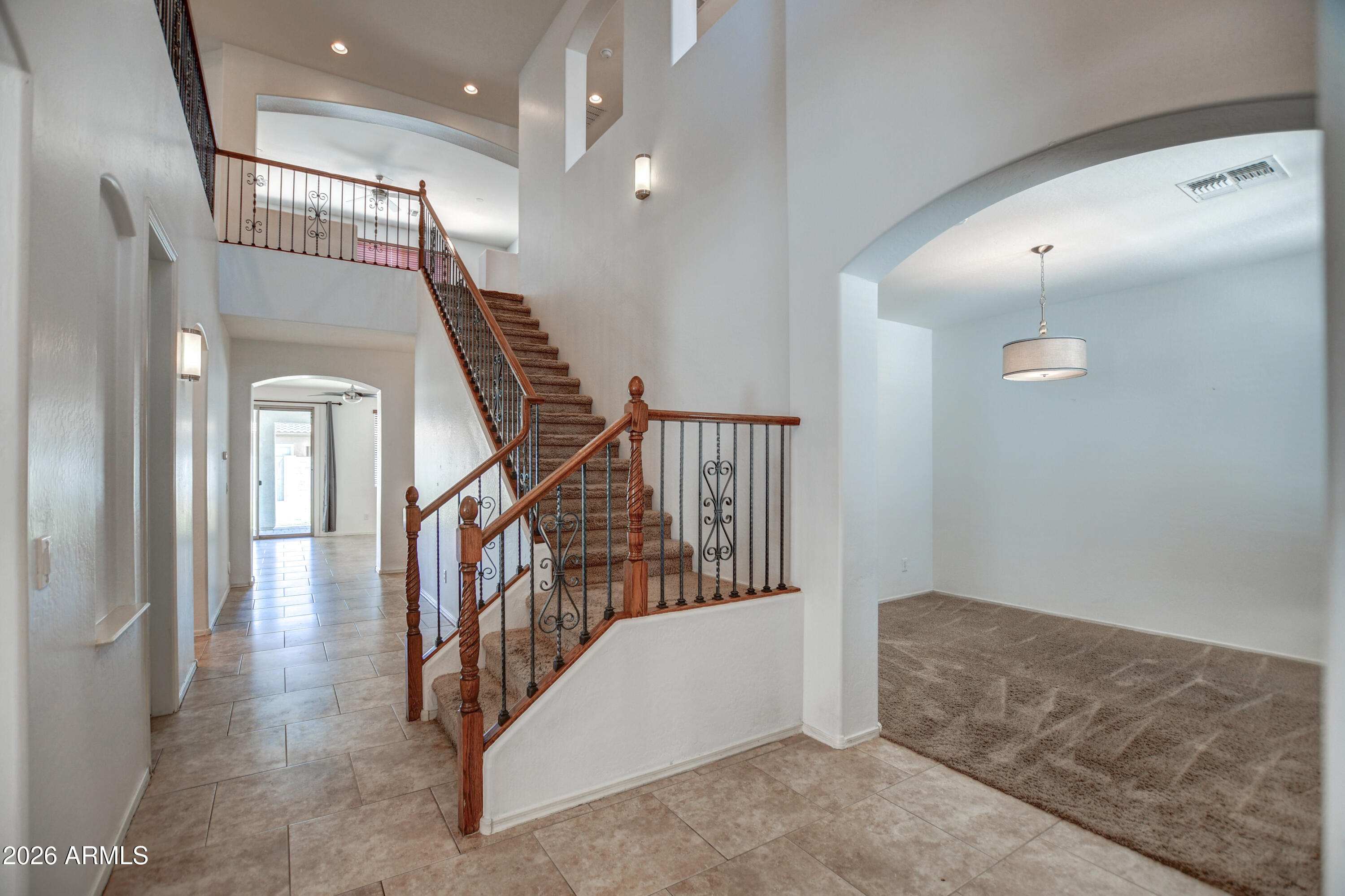 3078 East Muirfield Street Gilbert, AZ 85298 - Photo 13 of 92 a view of entryway and hall with wooden floor
