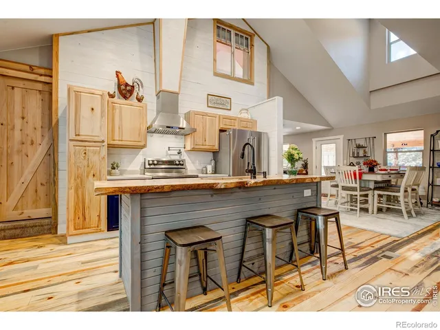 a view of kitchen with cabinets and wooden floor