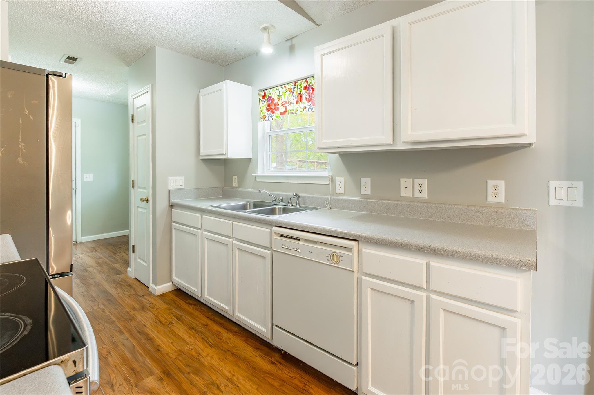 1021 Cedar Creek Road Kannapolis, NC 28083 - Photo 11 of 29 a kitchen with stainless steel appliances granite countertop a sink and cabinets