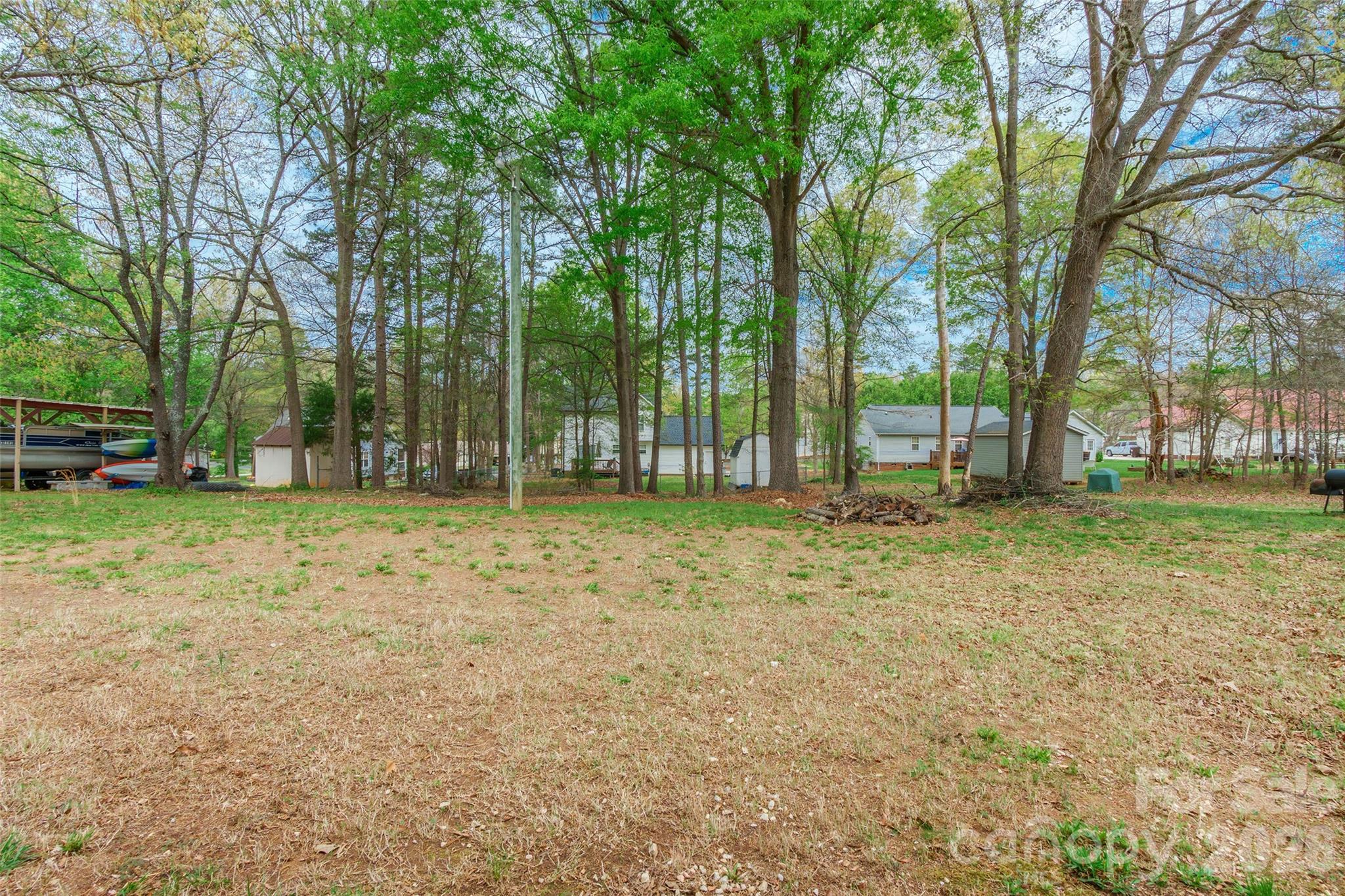 1021 Cedar Creek Road Kannapolis, NC 28083 - Photo 28 of 29 a backyard of a house with lots of green space