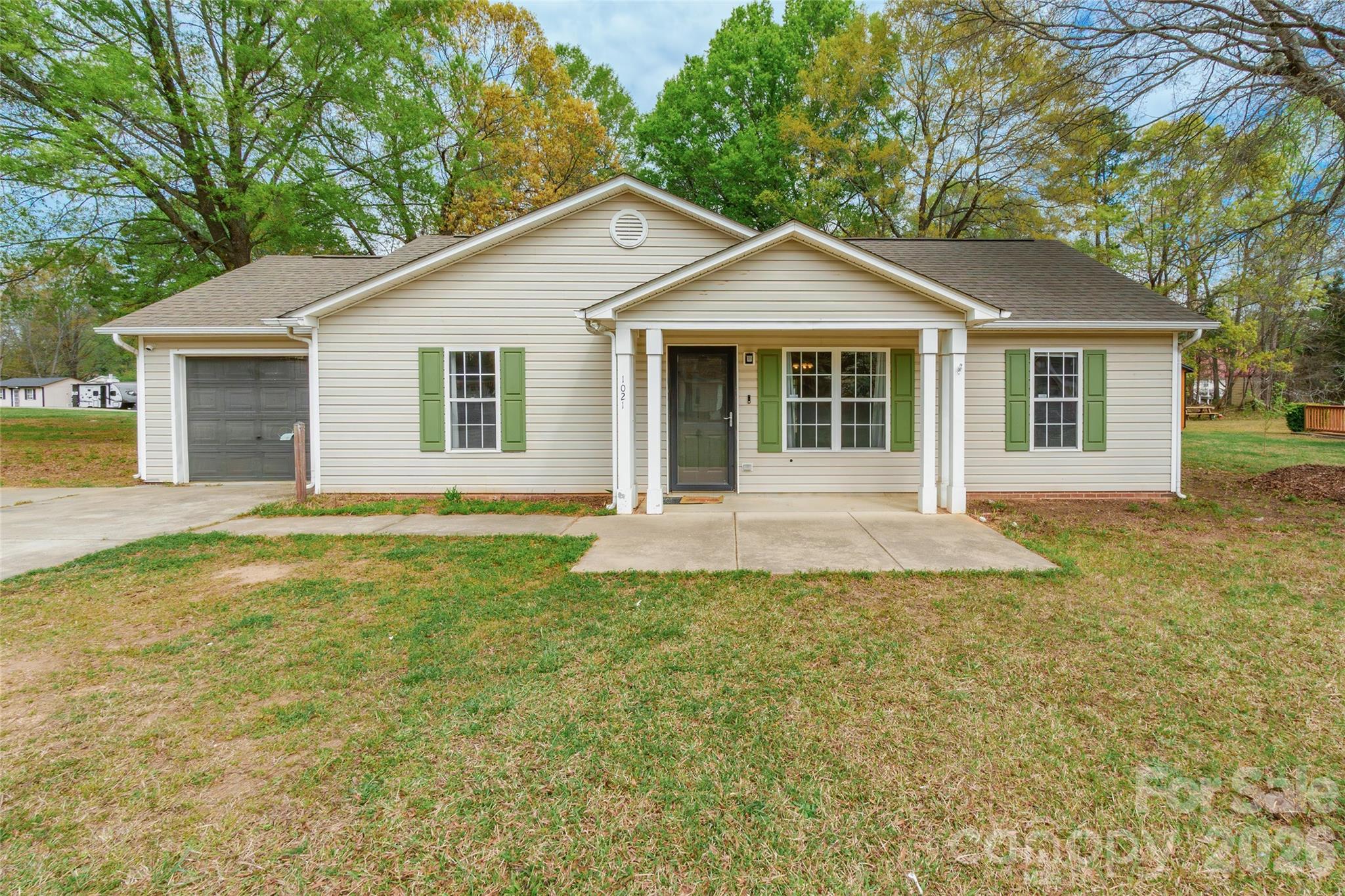 1021 Cedar Creek Road Kannapolis, NC 28083 - Photo 4 of 29 a front view of a house with yard and green space