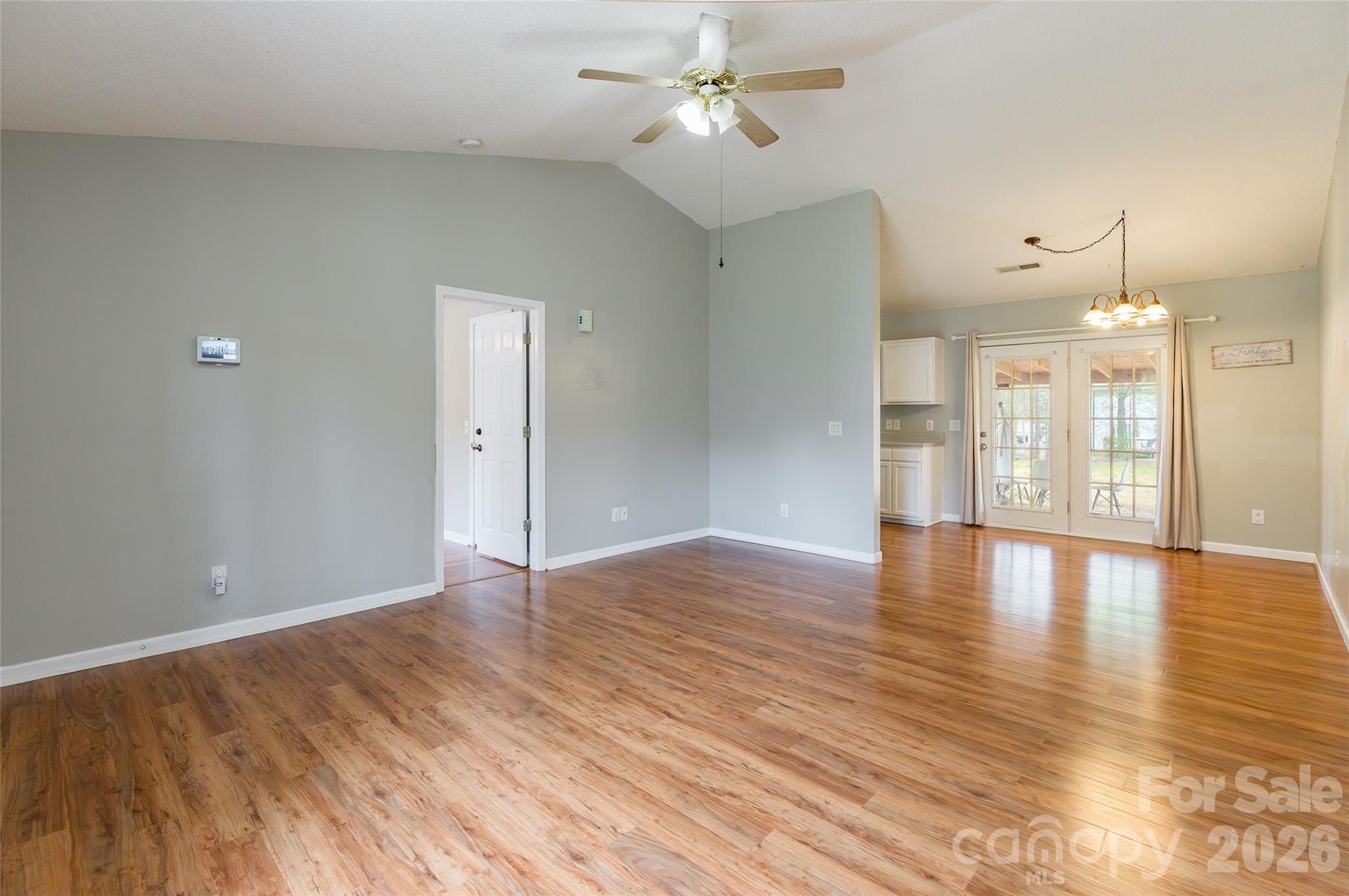 1021 Cedar Creek Road Kannapolis, NC 28083 - Photo 8 of 29 a view of an empty room with window and wooden floor