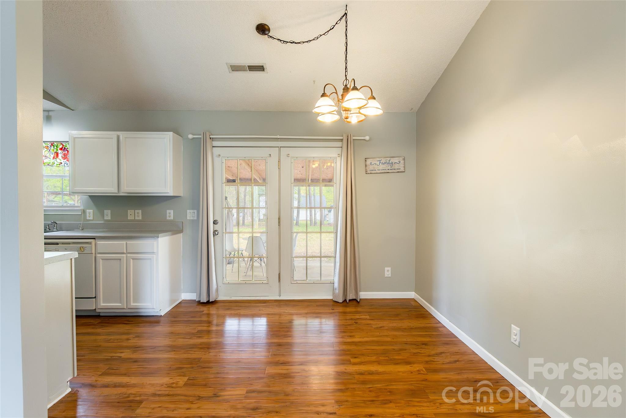 1021 Cedar Creek Road Kannapolis, NC 28083 - Photo 9 of 29 a view of a kitchen with granite countertop cabinets a sink and dishwasher