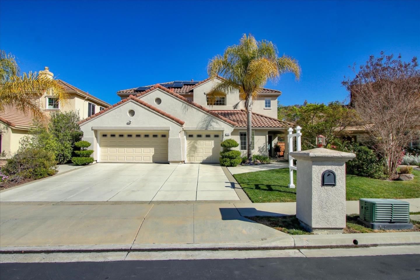 5869 Capilano Drive San Jose, CA 95138 - Photo 1 of 48 a front view of a house with a yard and garage