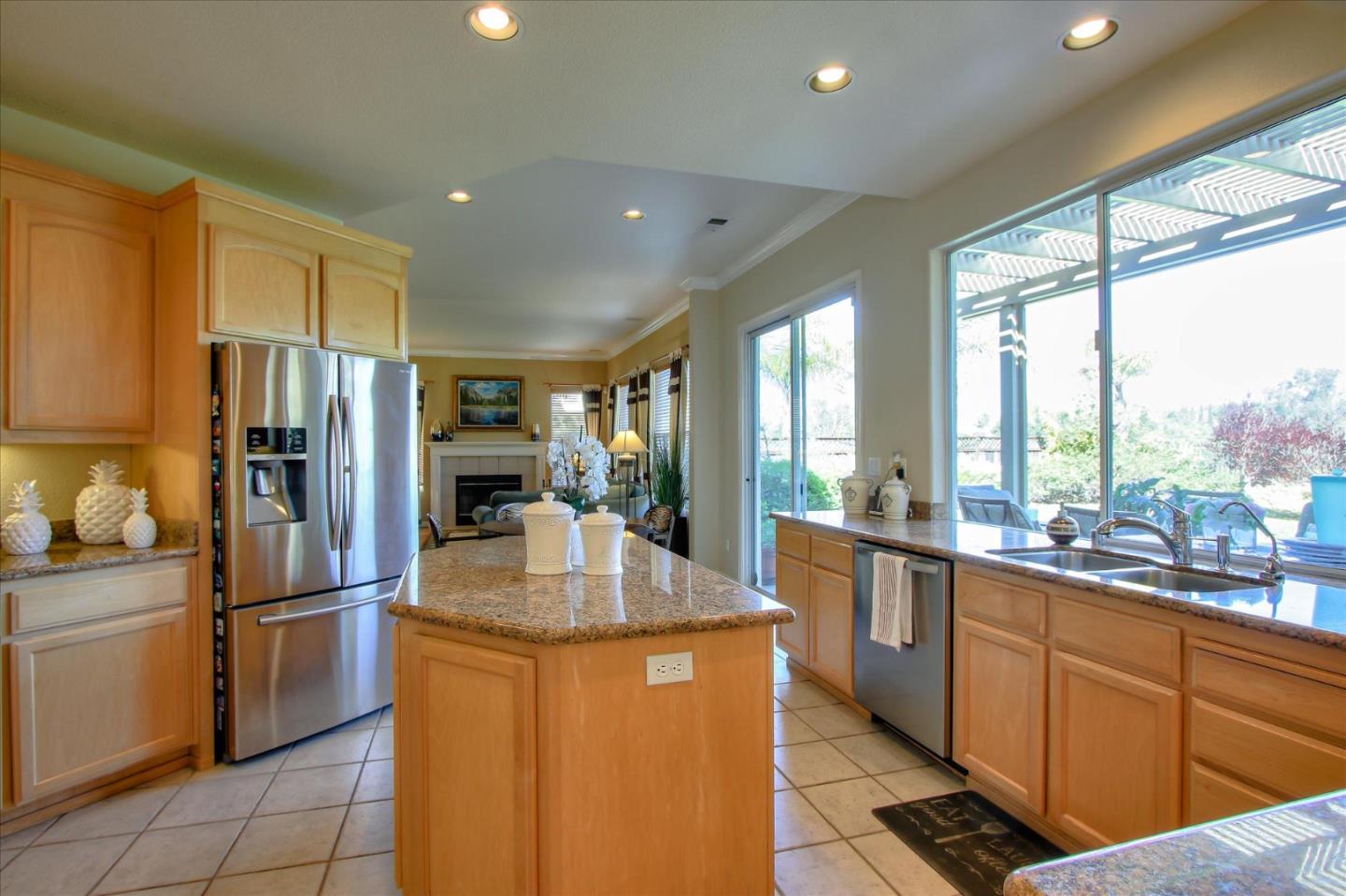 5869 Capilano Drive San Jose, CA 95138 - Photo 14 of 48 a kitchen with stainless steel appliances granite countertop a refrigerator a sink dishwasher a stove and a refrigerator with wooden floor