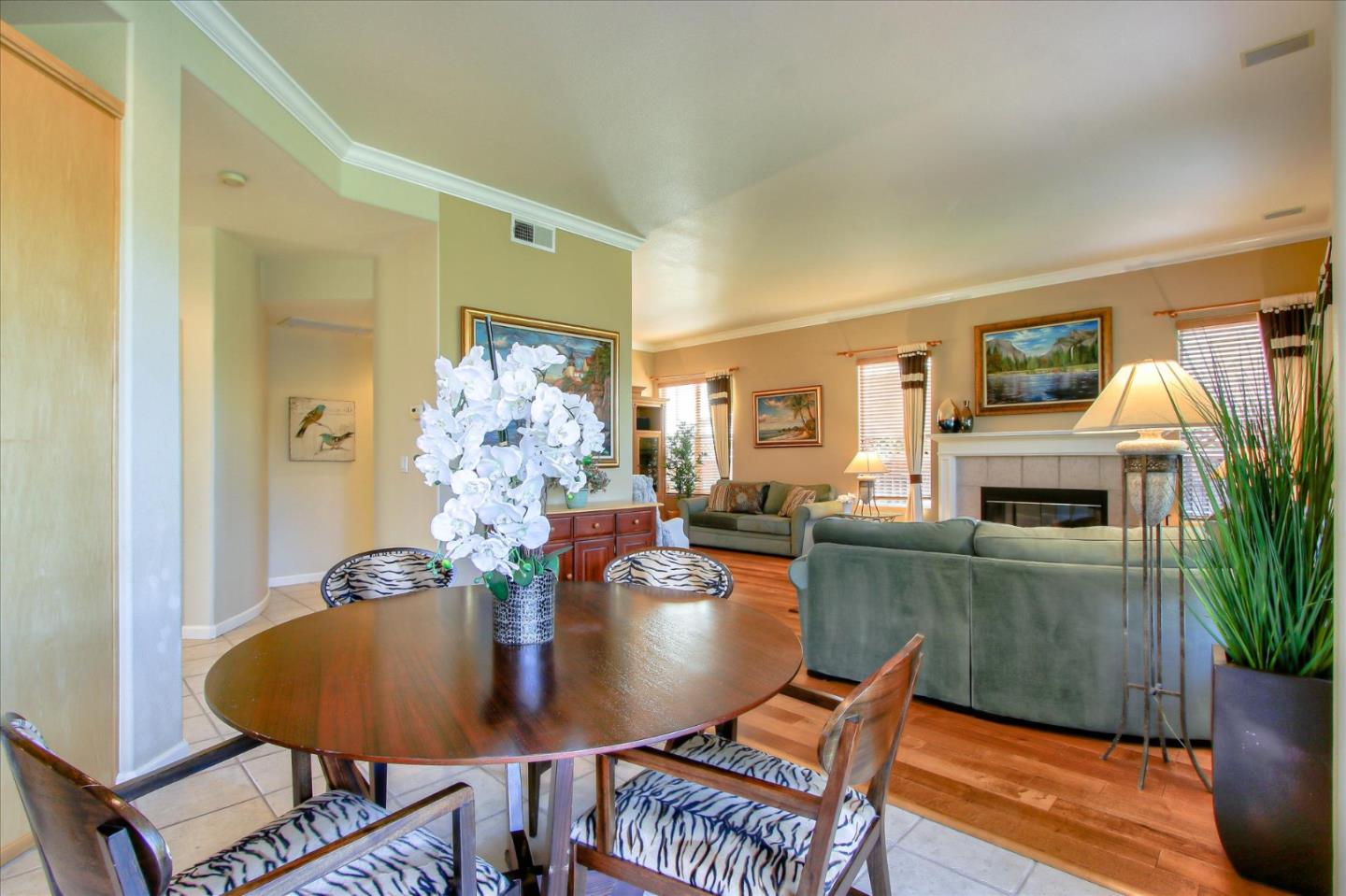 5869 Capilano Drive San Jose, CA 95138 - Photo 16 of 48 a dining room with furniture potted plants and wooden floor