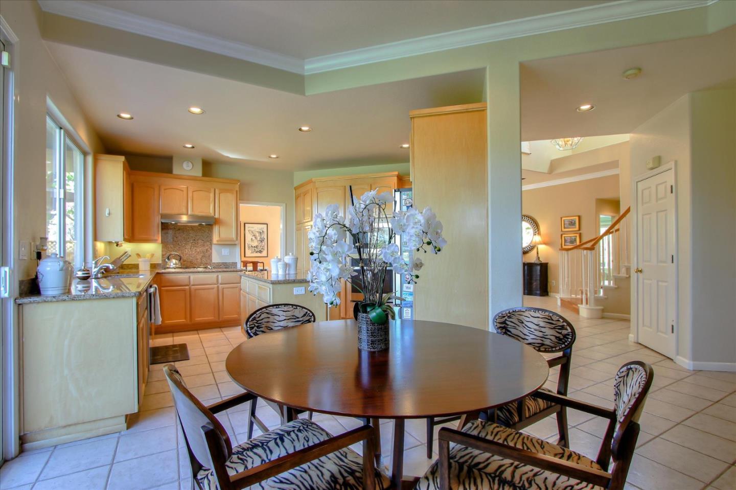 5869 Capilano Drive San Jose, CA 95138 - Photo 17 of 48 a view of a dining room with furniture and wooden floor