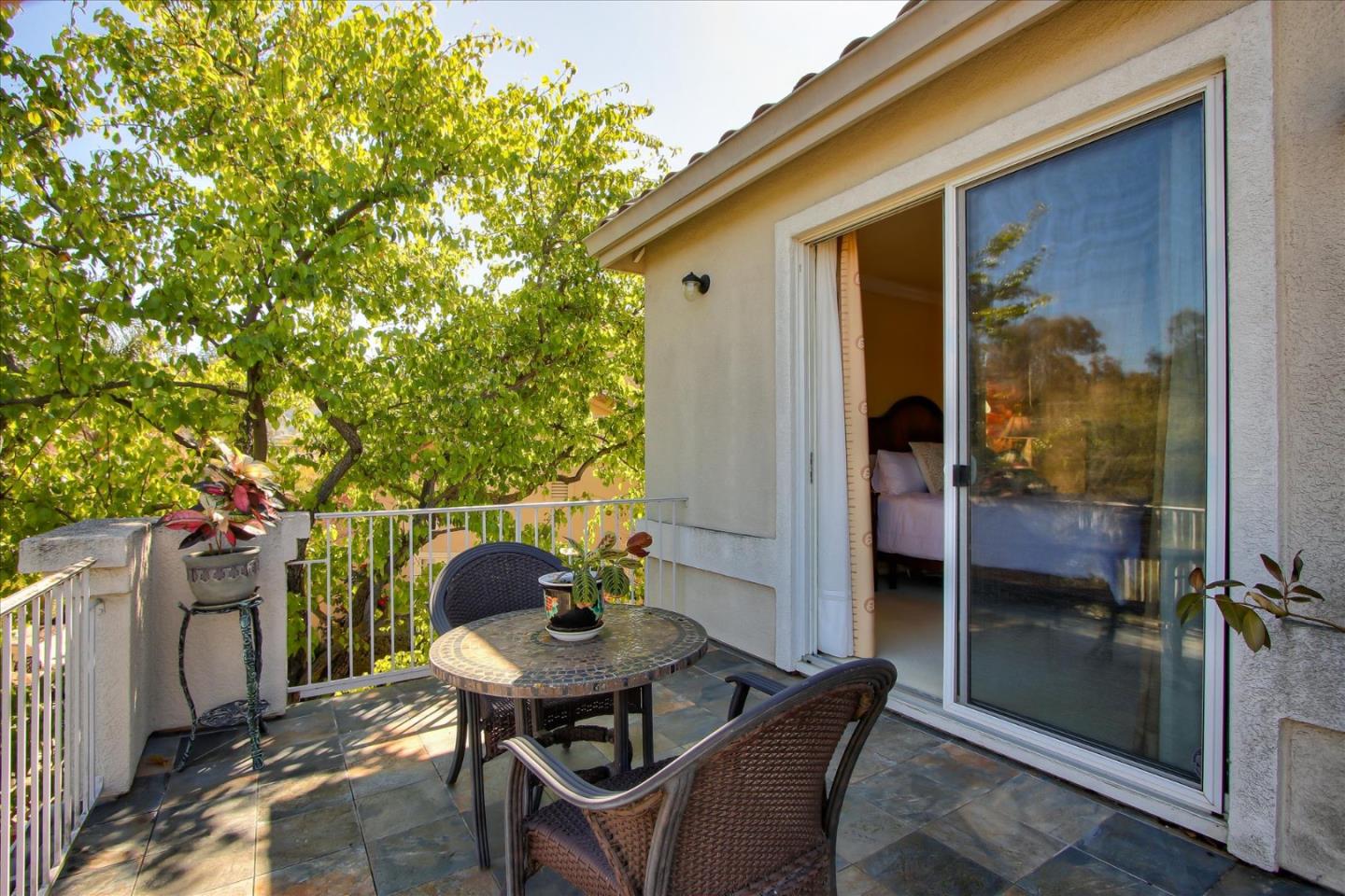 5869 Capilano Drive San Jose, CA 95138 - Photo 30 of 48 a patio with table and chairs and potted plants