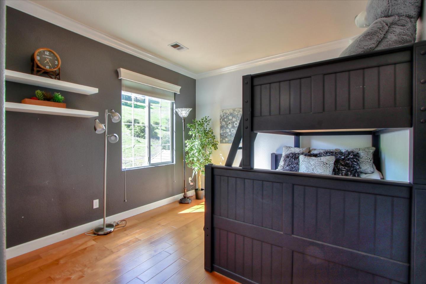 5869 Capilano Drive San Jose, CA 95138 - Photo 34 of 48 a kitchen with granite countertop wooden cabinets a sink and a window