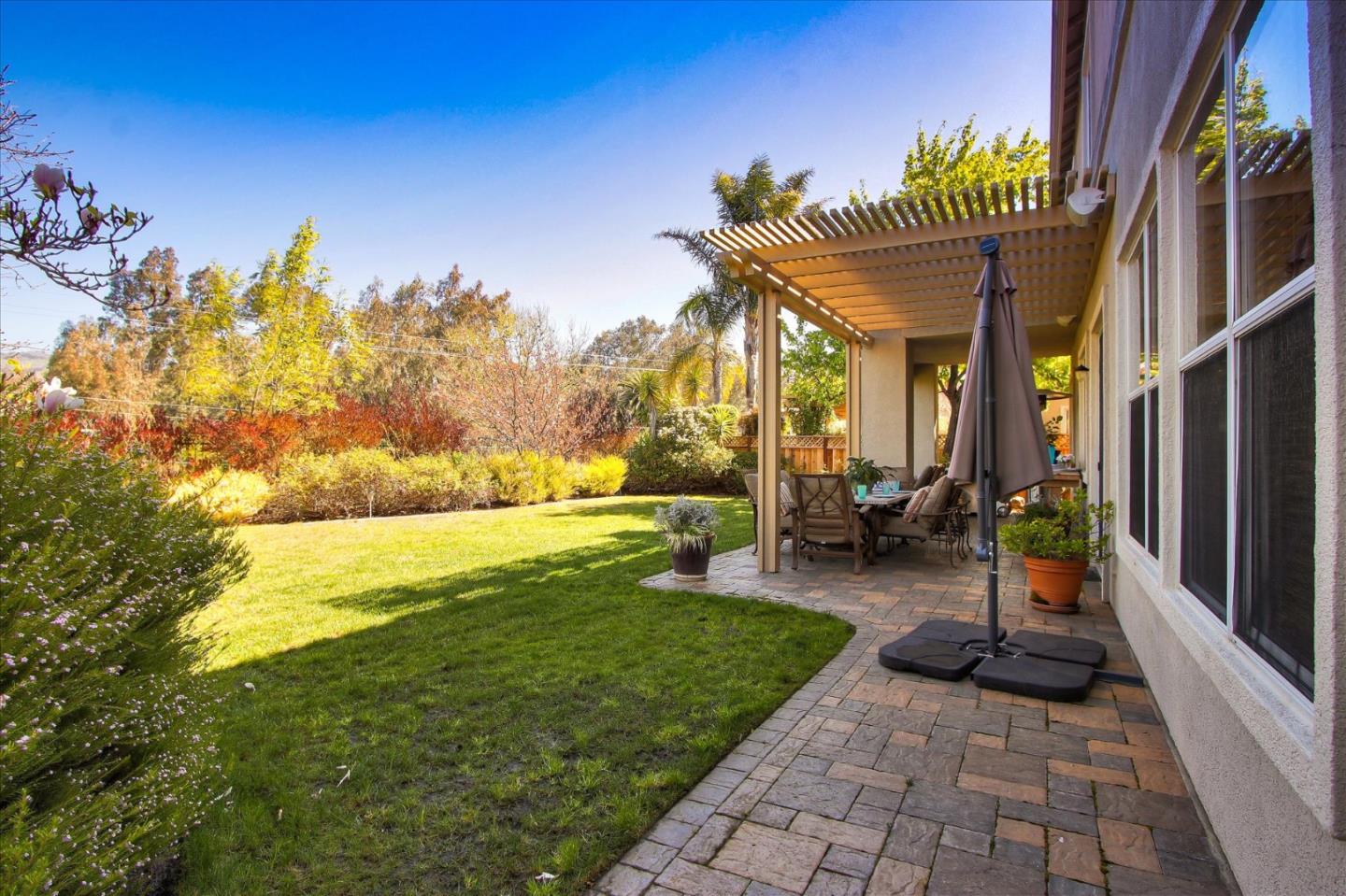 5869 Capilano Drive San Jose, CA 95138 - Photo 41 of 48 a view of a patio with table and chairs and potted plants