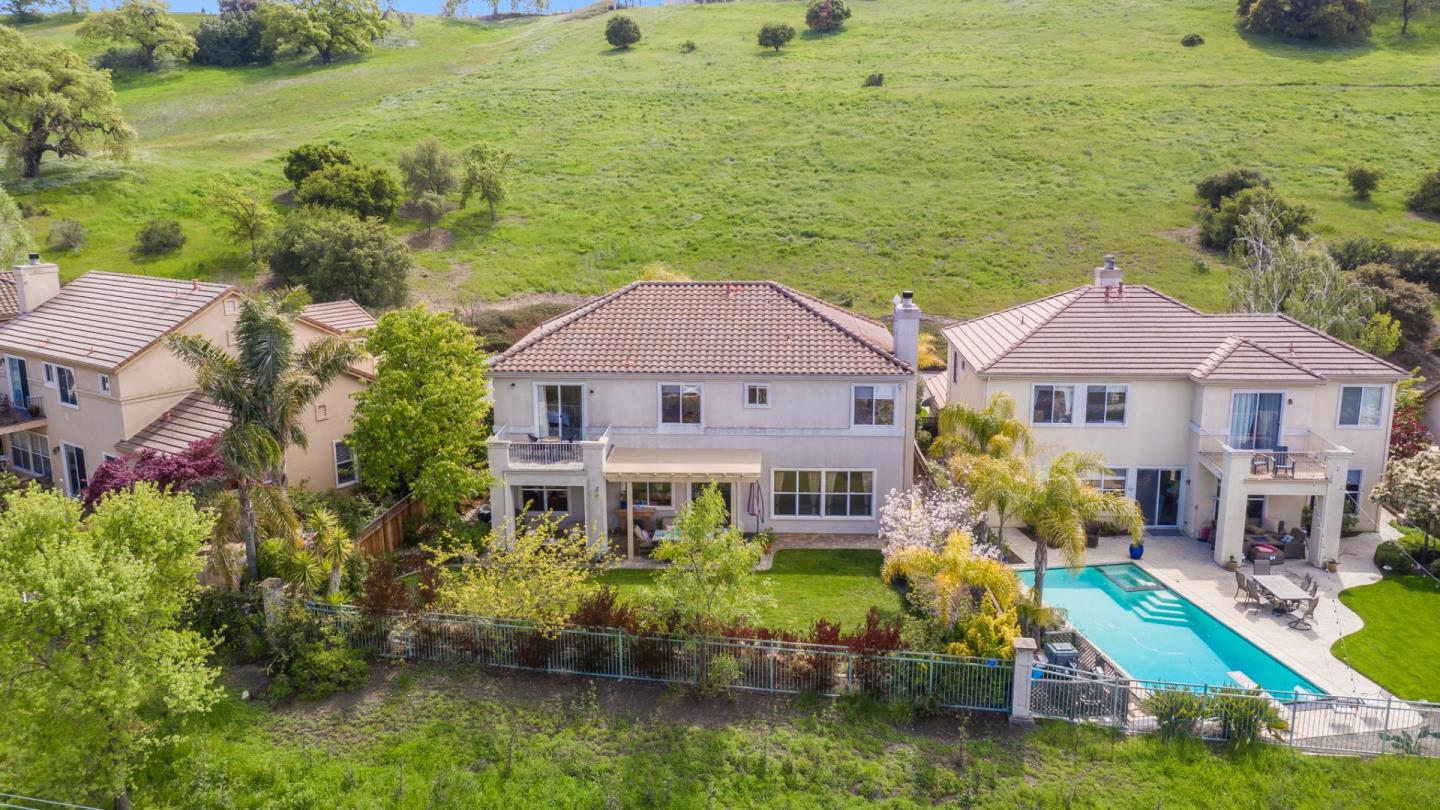 5869 Capilano Drive San Jose, CA 95138 - Photo 48 of 48 a aerial view of a house with swimming pool and a yard