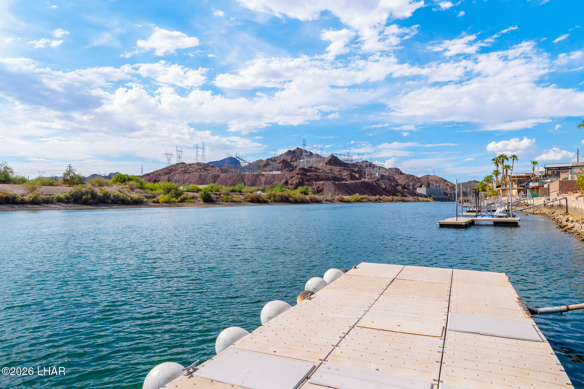 3170 Parker Dam Road, Unit 8 Parker, AZ 85344 - Photo 30 of 53 a view of a lake with houses in the back
