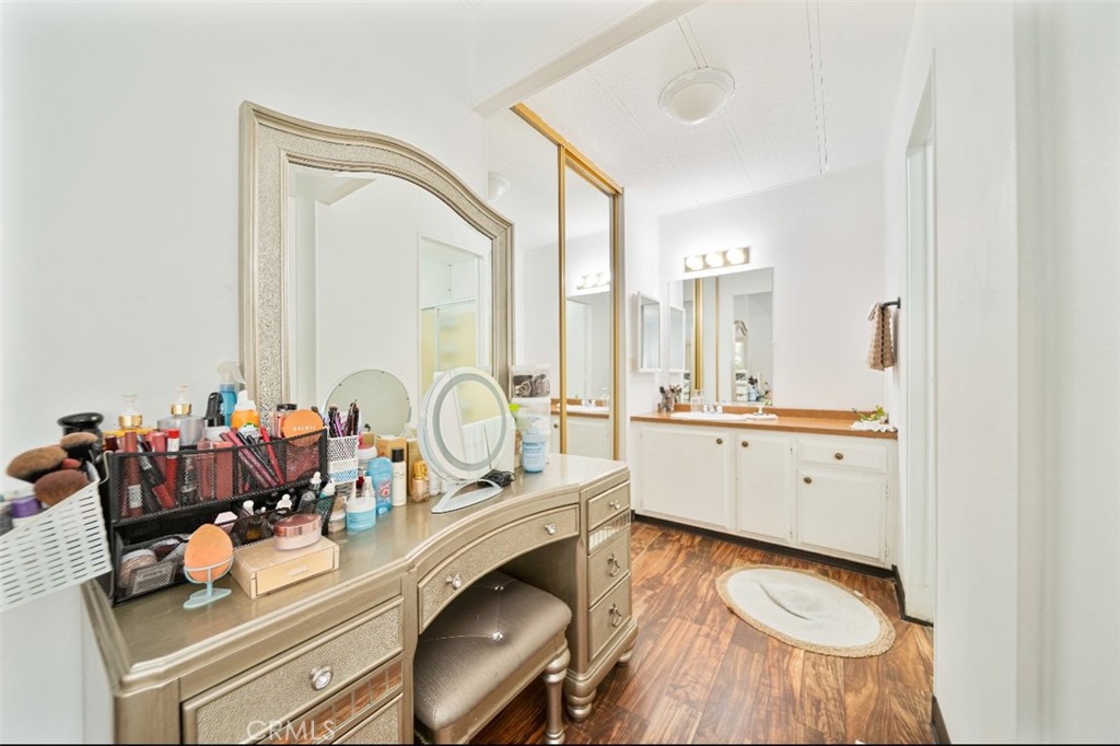 5700 Carbon Canyon Road, Unit 130 Brea, CA 92823 - Photo 13 of 17 a bathroom with a double vanity sink and mirror