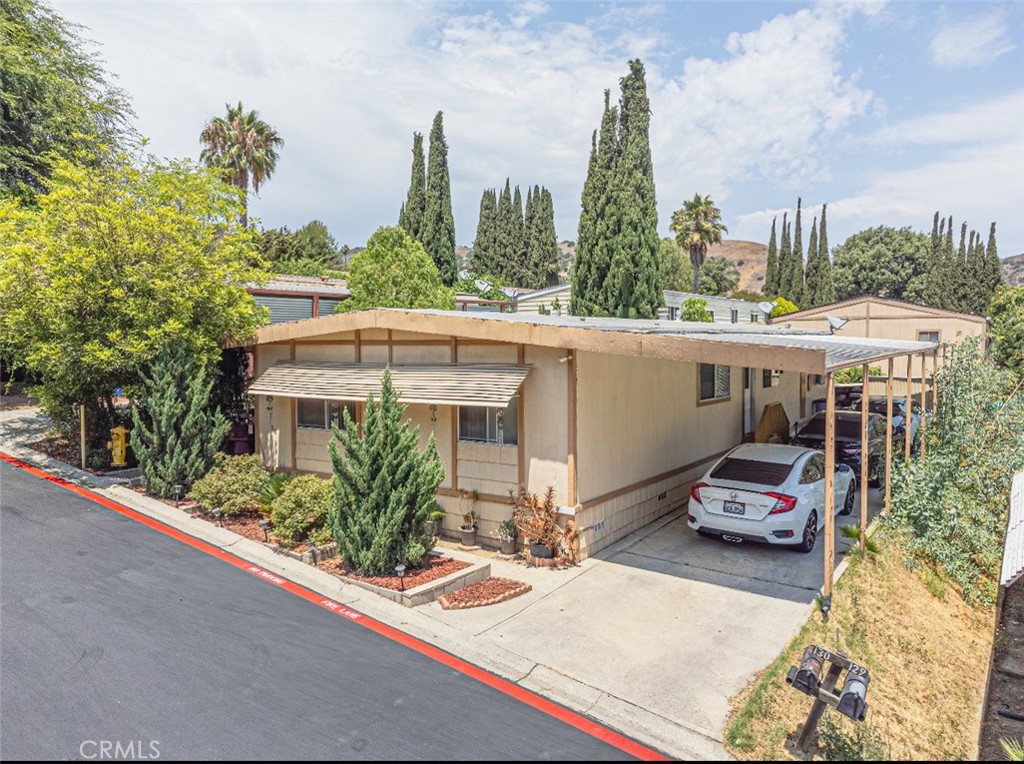 5700 Carbon Canyon Road, Unit 130 Brea, CA 92823 - Photo 15 of 17 a car parked in front of a building