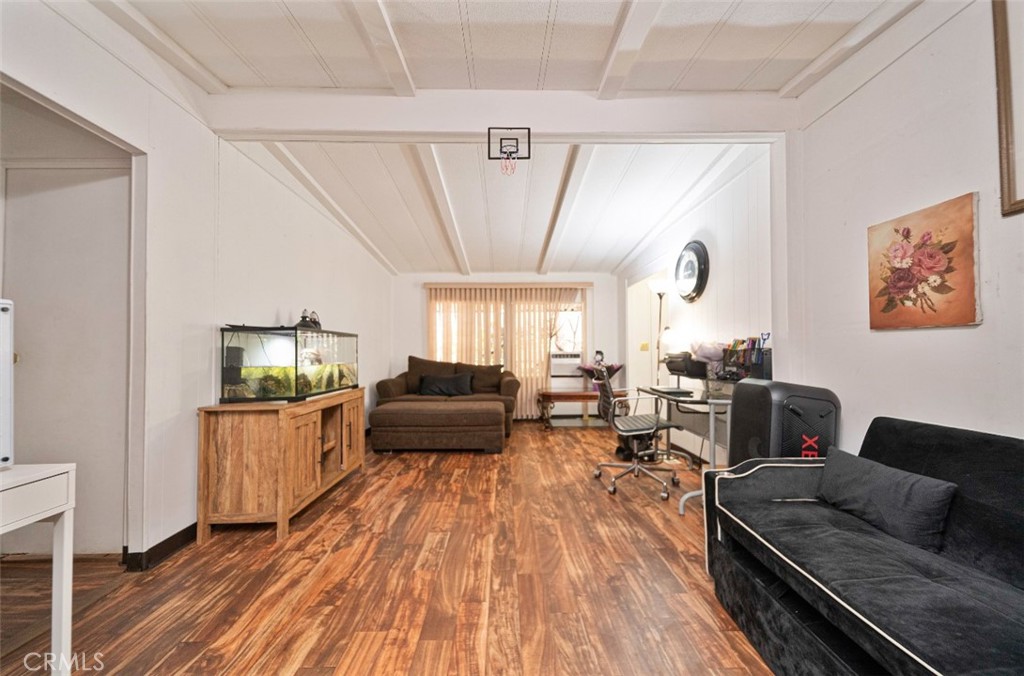 5700 Carbon Canyon Road, Unit 130 Brea, CA 92823 - Photo 4 of 17 a living room with furniture and a wooden floor