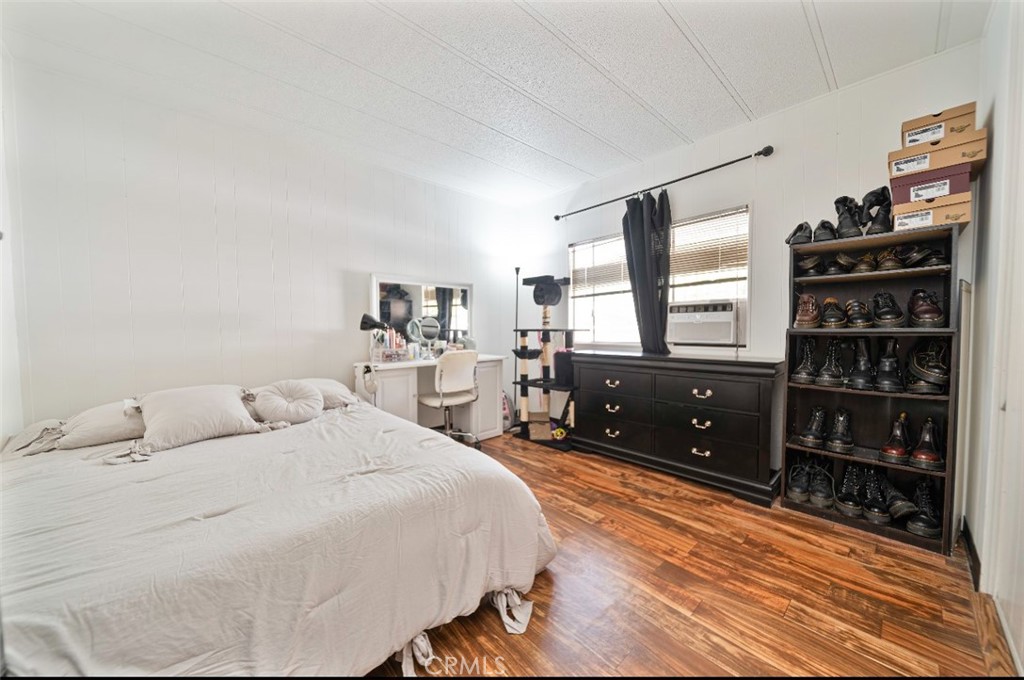 5700 Carbon Canyon Road, Unit 130 Brea, CA 92823 - Photo 9 of 17 a bedroom with a bed cabinets and walk in closet