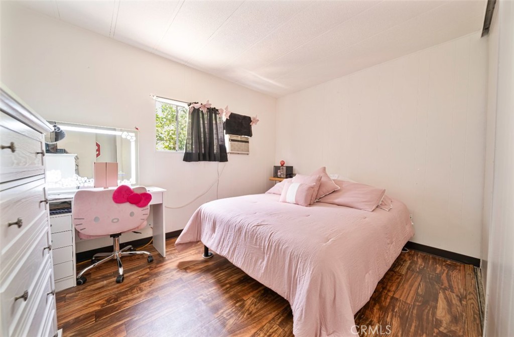 5700 Carbon Canyon Road, Unit 130 Brea, CA 92823 - Photo 10 of 17 a bedroom with a bed and furniture