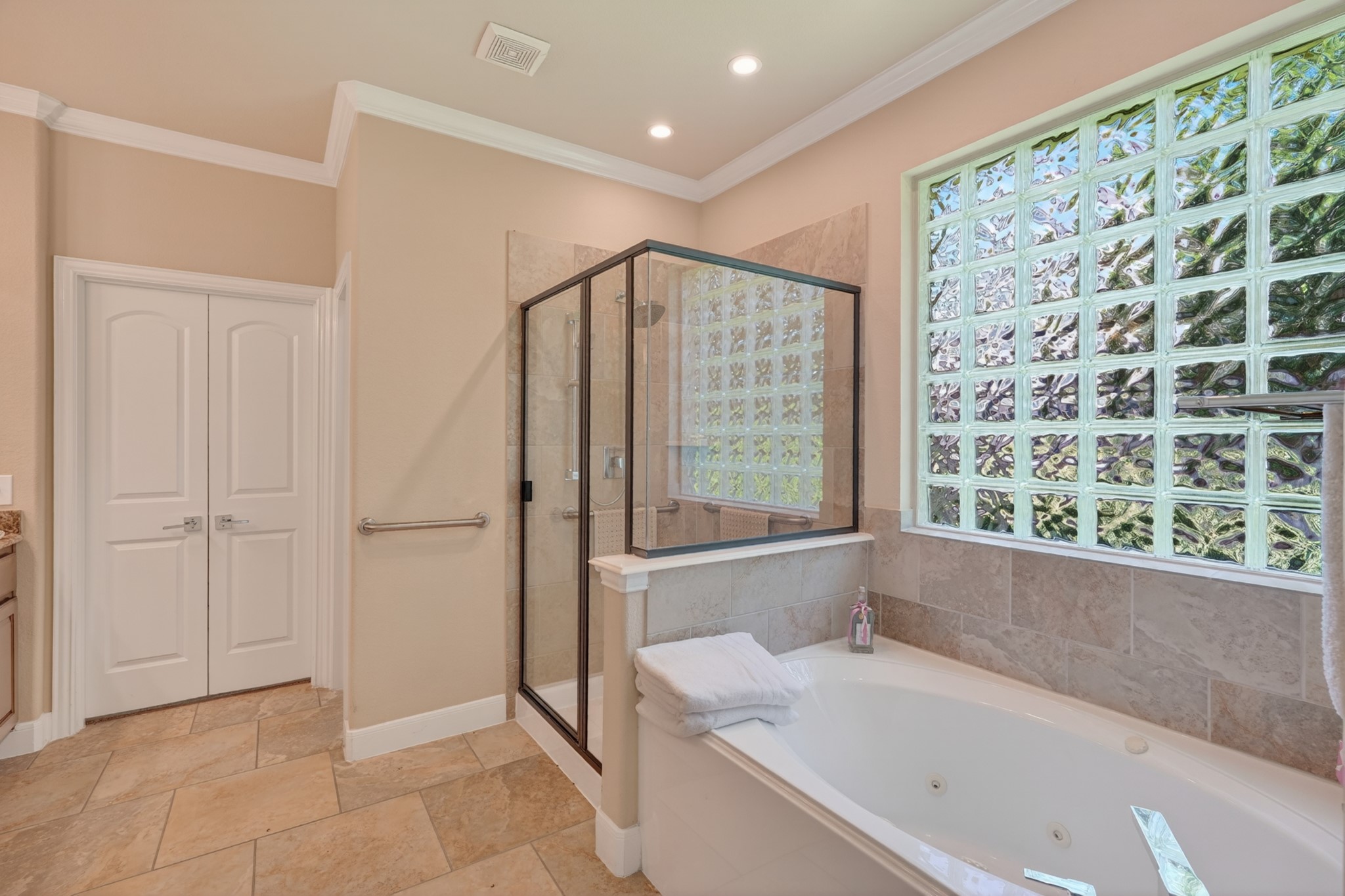 55 South Victoriana Circle Spring, TX 77389 - Photo 26 of 40 a bathroom with a bathtub and a shower