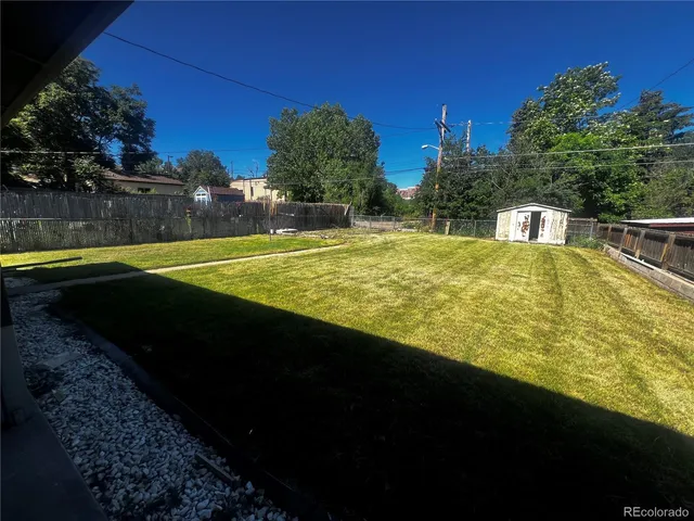 a view of a swimming pool with an outdoor space and seating area