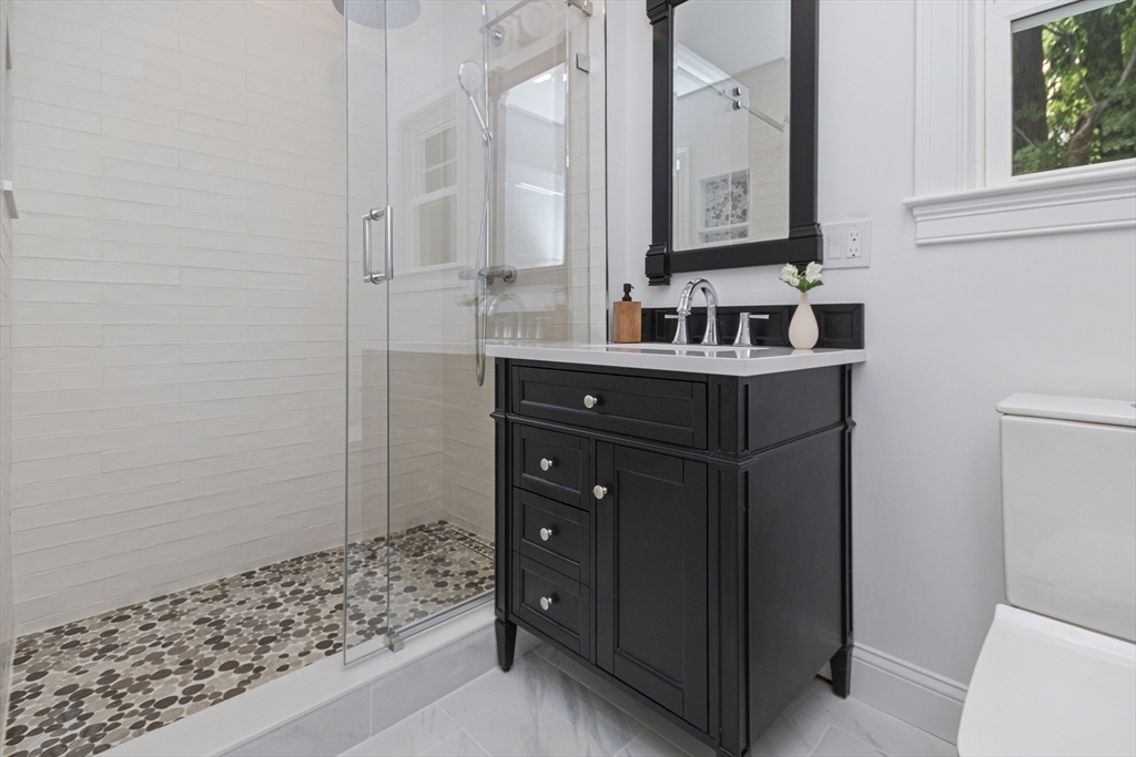 22 Stafford Road Newton, MA 02459 - Photo 13 of 28 a bathroom with a sink and a mirror