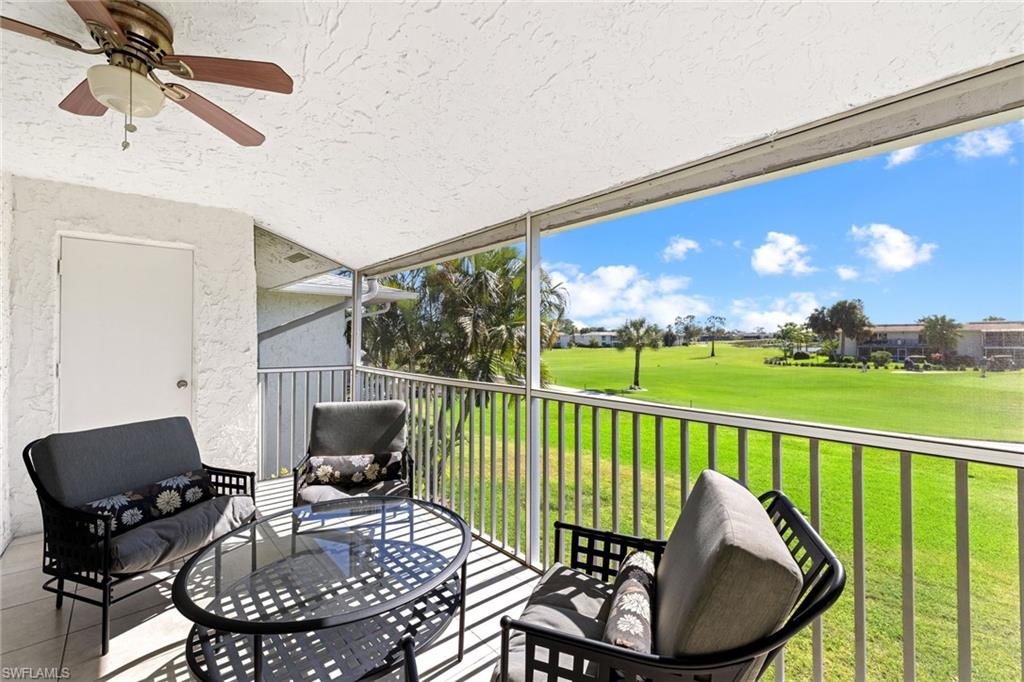 108 Penny Lane, Unit 4 Naples, FL 34112 - Photo 23 of 31 a view of a chairs and table in patio