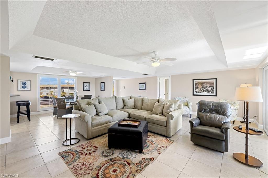 108 Penny Lane, Unit 4 Naples, FL 34112 - Photo 31 of 31 a living room with furniture and a table