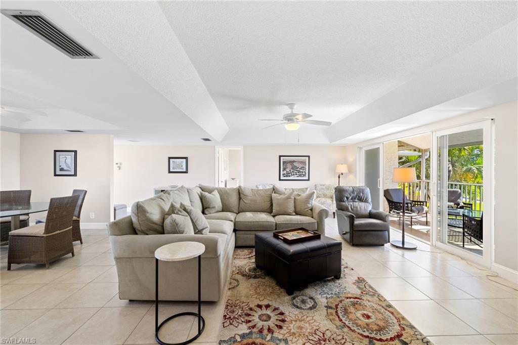 108 Penny Lane, Unit 4 Naples, FL 34112 - Photo 7 of 31 a living room with furniture and a window