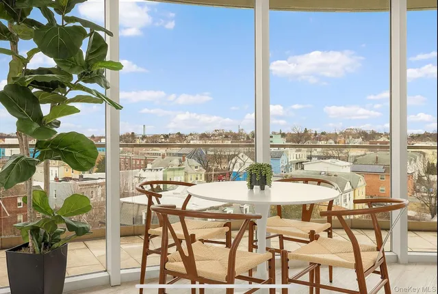 a view of lake from balcony with seating space