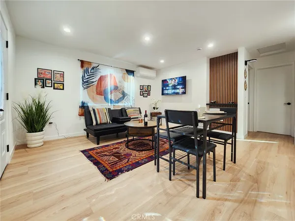 a living room with furniture and a rug