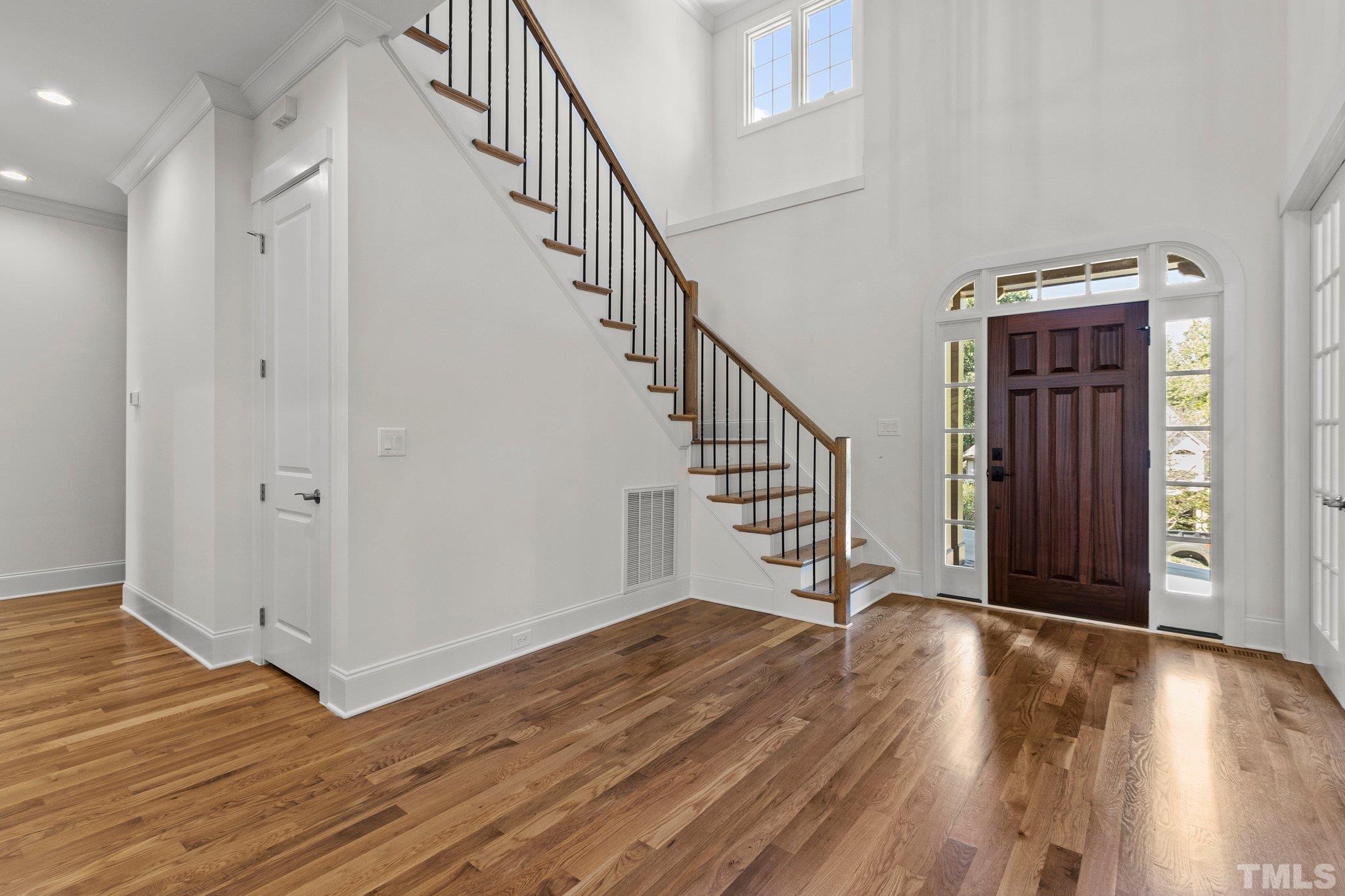 20003 Bragg Chapel Hill, NC 27517 - Photo 12 of 36 a view of entryway with wooden floor and stairs