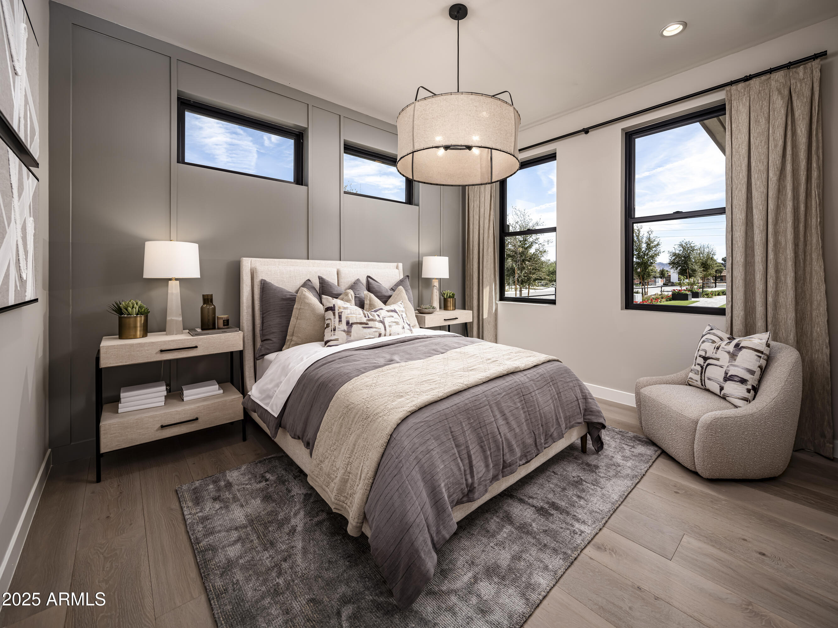 21922 South 193rd Way Queen Creek, AZ 85142 - Photo 28 of 38 a spacious bedroom with a bed and a chandelier