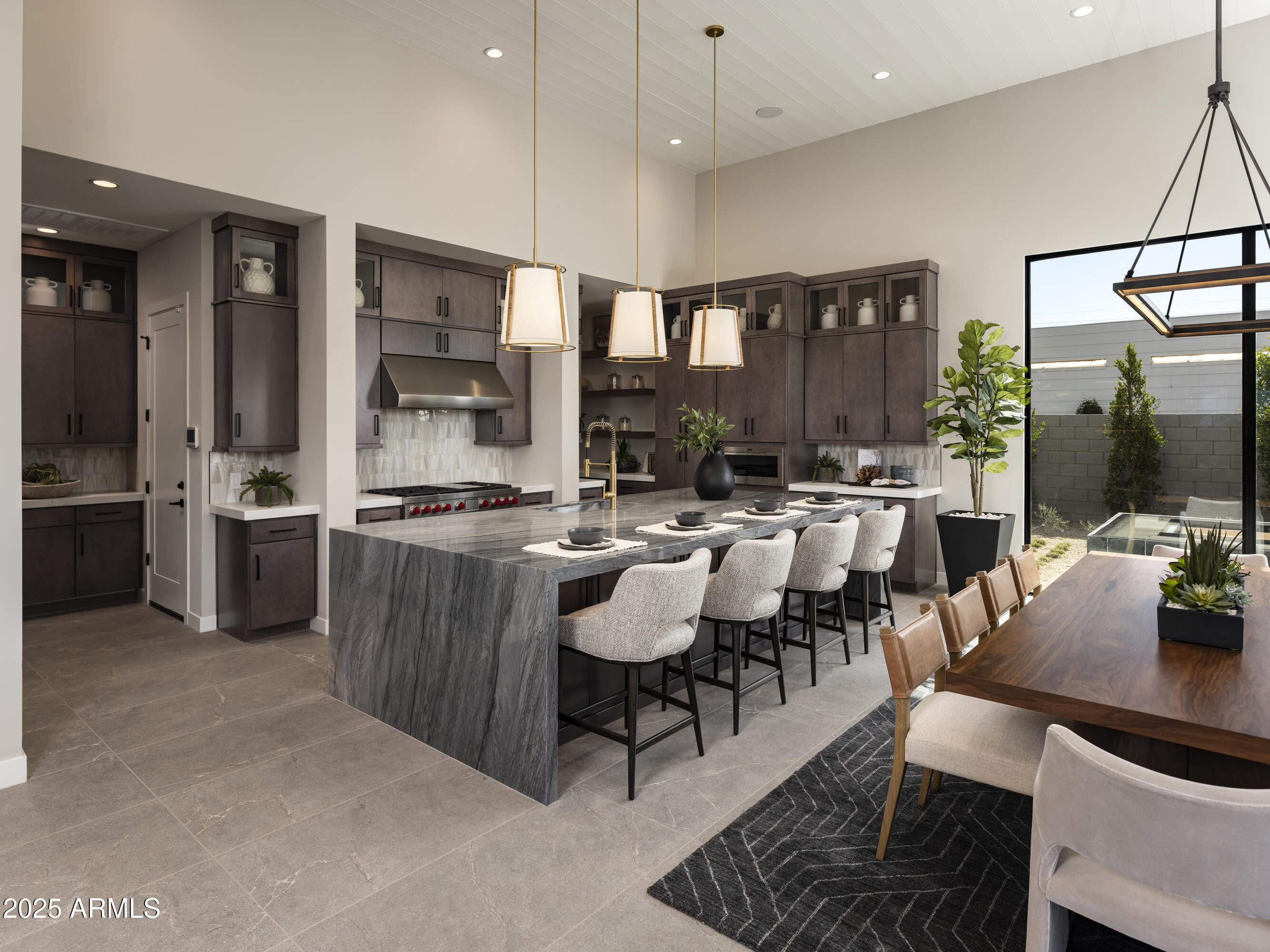 21922 South 193rd Way Queen Creek, AZ 85142 - Photo 10 of 38 a dining room with stainless steel appliances kitchen island granite countertop a table chairs and a view of living room