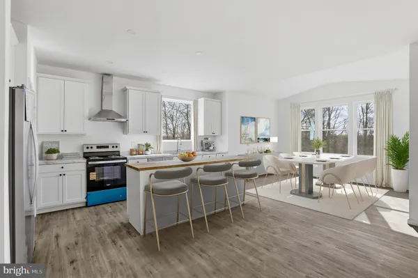 a kitchen with a sink and stove top oven