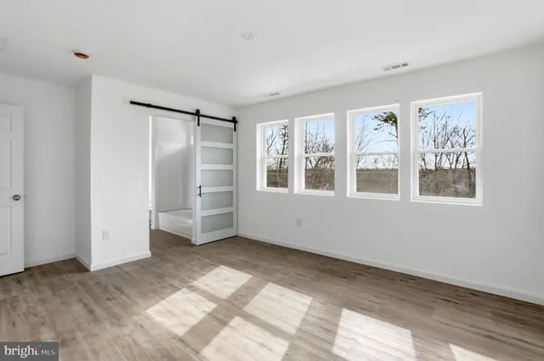a bathroom with a tub shower and vanity