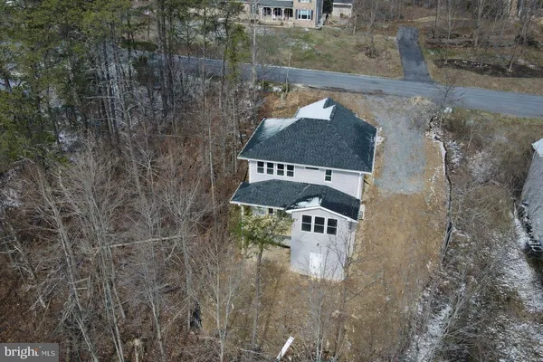 an aerial view of residential house with outdoor space