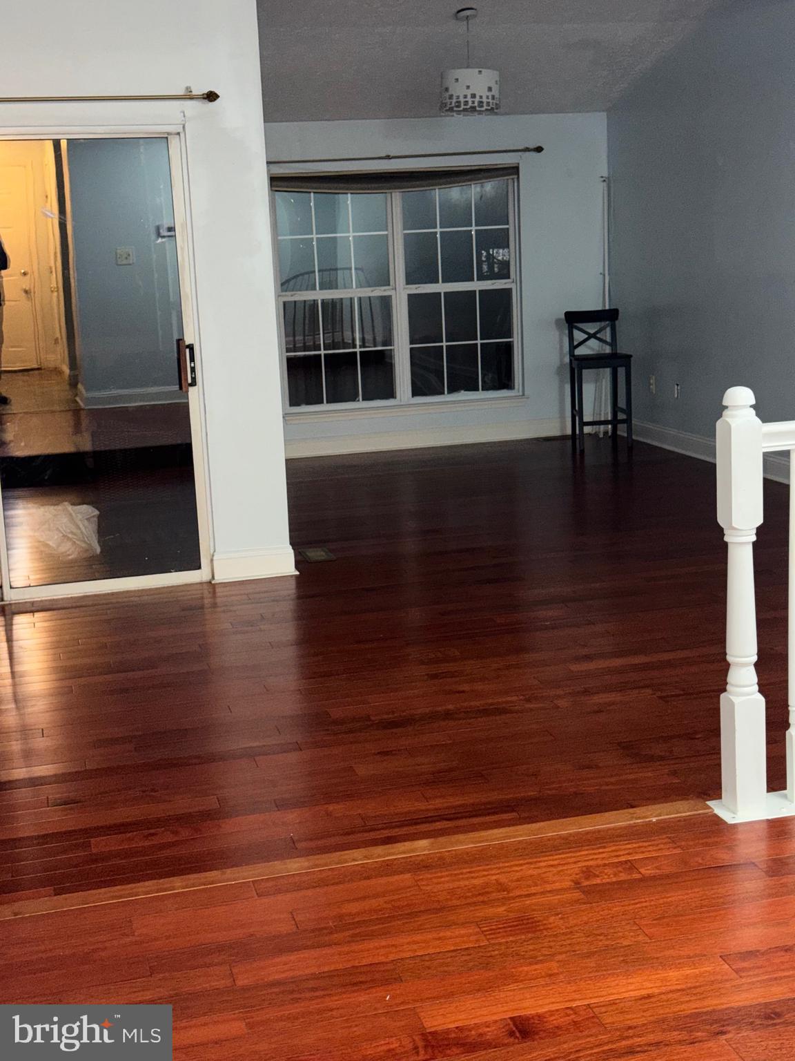 7148 Natures Road Columbia, MD 21046 - Photo 34 of 49 a view of empty room with wooden floor and window